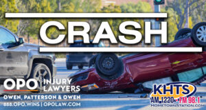 Rollover two- car crash at an intersection. A red sedan is on its roof. "crash" overlaid in white capital letters with the KHTS and OPO logo