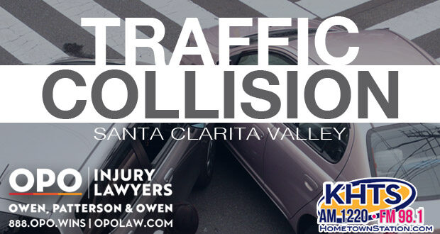 Two-car collision at an intersection. "Traffic Collision" overlaid in white capital letters with the KHTS and OPO logo -- crash traffic collision