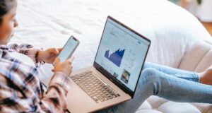 Woman on phone and laptop