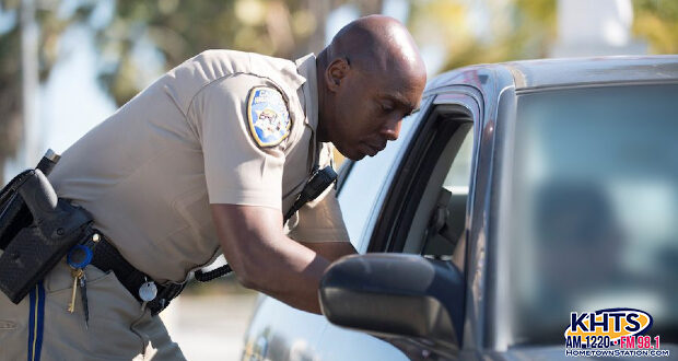 chp officer leaning into a car window