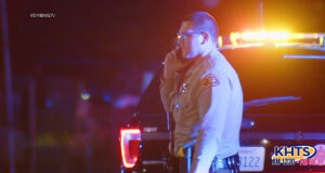 A sheriff deputy stands on scene