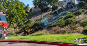 Firefighters cleaning up a 1/4 acre brush fire