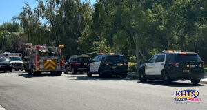 Fire and Sheriff's Car parked outside a house