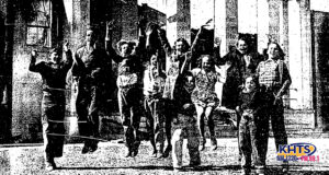Students excited outside of a burned down school
