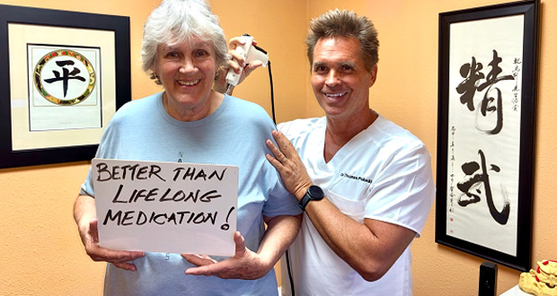 Chiropractor adjusting patient during functional exam in Santa Clarita office